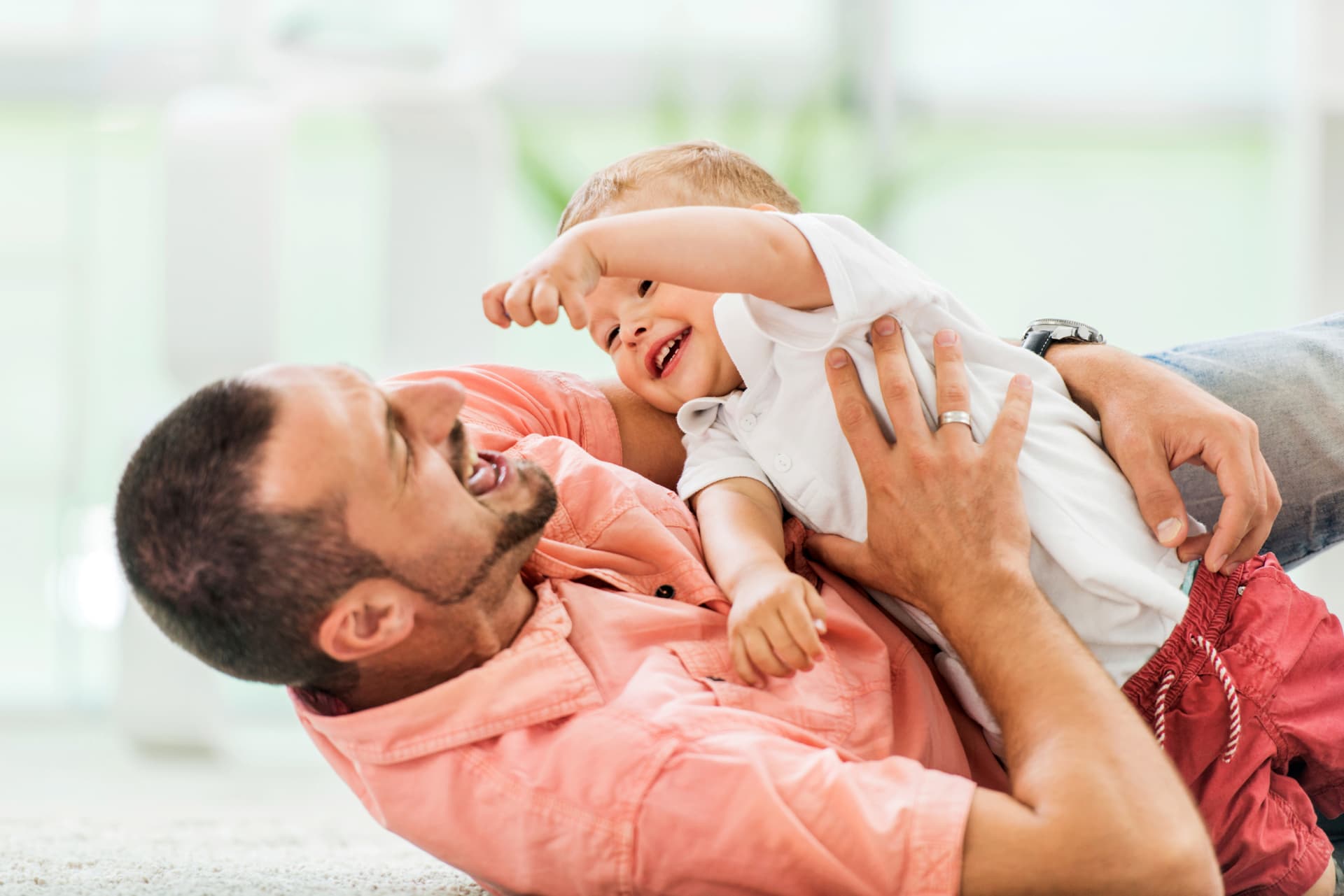 A father playing with his young child